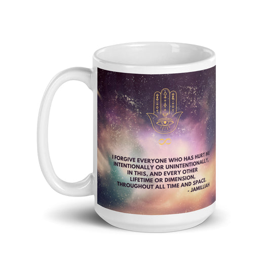 White, purple, green, and yellow cosmos/universe/galaxy/space design.  Glossy, ceramic, 15oz coffee/tea mug with original logo and quote, left handle. Spiritual, enlightening, hamsa hand/infinity symbol brand logo. Cosmos/universe/galaxy/space design. Original otherworldly, wise quote. "I Forgive Everyone Who Has Hurt Me Intentionally Or Unintentionally, In This, And Every Other Lifetime Or Dimension, Throughout All Time And Space." - Jamilliah - JAMILLIAH'S WISDOM IS TIMELESS SHOP - wisdomistimeless.com.