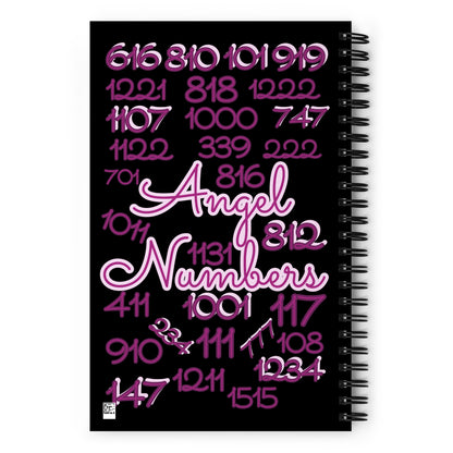 Wire-o spiral notebook journal. Black cover with purple and purple/pink angel numbers, back view. Angel numbers 616, 810, 101, 919, 1221, 818, 1222, 1107, 1000, 747, 1122, 339, 222, 701, 816, 1011, 1131, 812, 411, 1001, 117, 910, 234, 111, 777, 108, 147, 1211, 1234, and 1515. 5.5 inches x 8.5 inches. 140 dotted pages with soft flexible covers. Jamilliah's Wisdom Is Timeless Shop - wisdomistimeless.com.