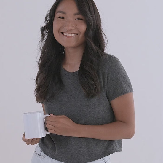 White Glossy Mug video with female model showcasing left, right, middle, and inside of mug. JAMILLIAH'S WISDOM IS TIMELESS SHOP - wisdomistimeless.com.