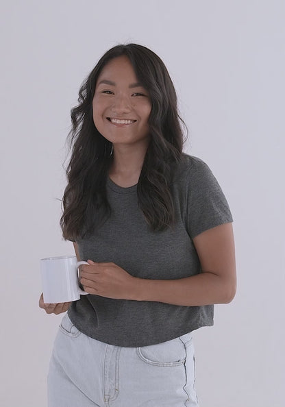 White Glossy Mug video. Front, inside, and side of mug. Shown with female model showcasing mug. JAMILLIAH'S WISDOM IS TIMELESS SHOP - wisdomistimeless.com.