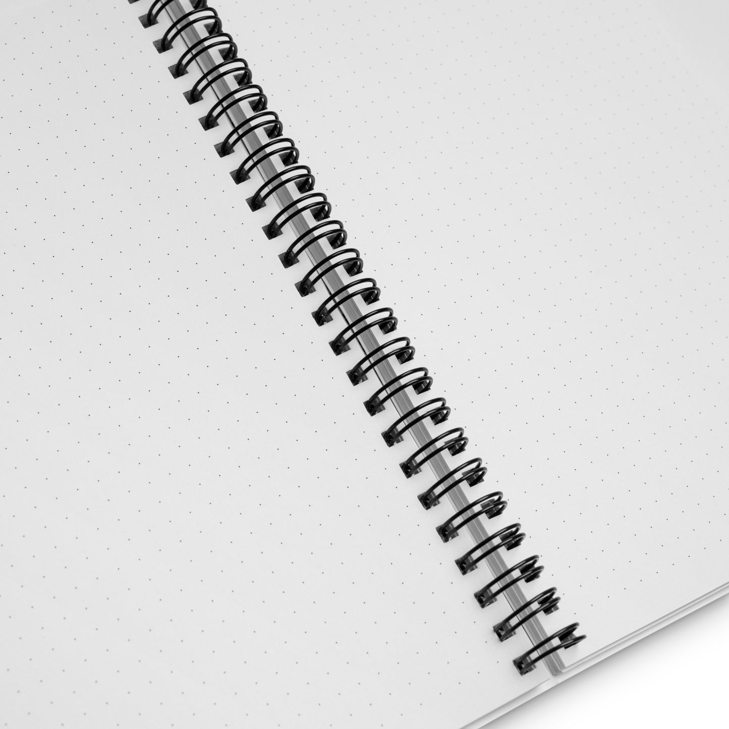 Manifesting journal spiral notebook. Product details of white pages, black dots, and metal wire binding. 140 dotted pages. 5.5 inches x 8.5 inches. Jamilliah's Wisdom Is Timeless Shop - wisdomistimeless.com.